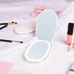 Espejo de maquillaje cosmético LED plegable de viaje portátil de mano con luces