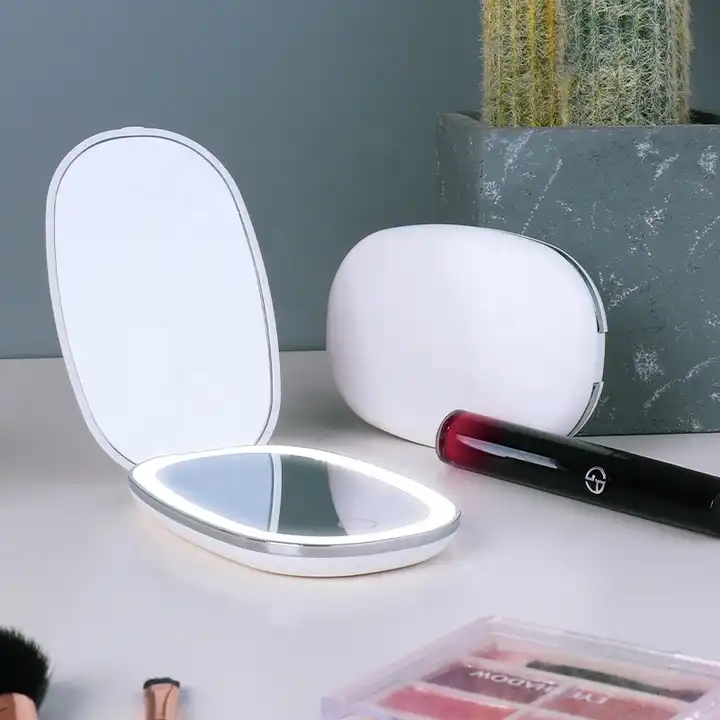 Espejo de maquillaje cosmético LED plegable de viaje portátil de mano con luces